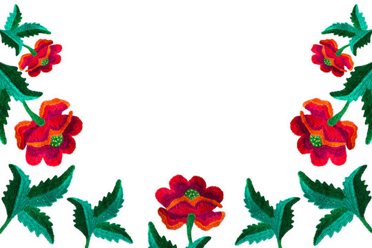 Pattern of embroidered flowers with smooth handwork on white background isolate with copy space of flat top view