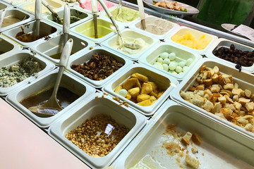 Different salads choice in containers fast food in buffet. Different ingredients: Potatoes, eggs, croutons, beans and other various products.