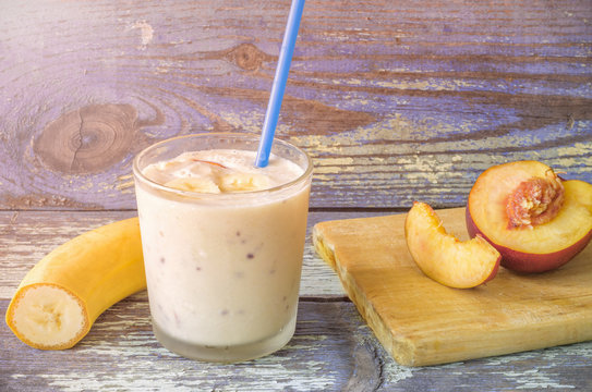 Fruit Smoothies. Milkshake with peach and banana. Peach banana smoothies. Delicious and healthy breakfast