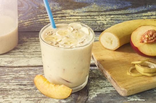 Fruit Smoothies. Milkshake with peach and oatmeal. Peach banana smoothies. Delicious and healthy breakfast