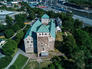 Fototapeta na wymiar aerial view on Turku Castle is a medieval building in the city oldest buildings still in use in Finland. It was founded in the late 13th century and stands on the banks of the Aura River.
