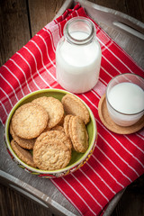 Stack of freshly baked oat biscuits in a bowl.