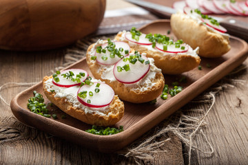 Toasts with radish, chives and cottage cheese.
