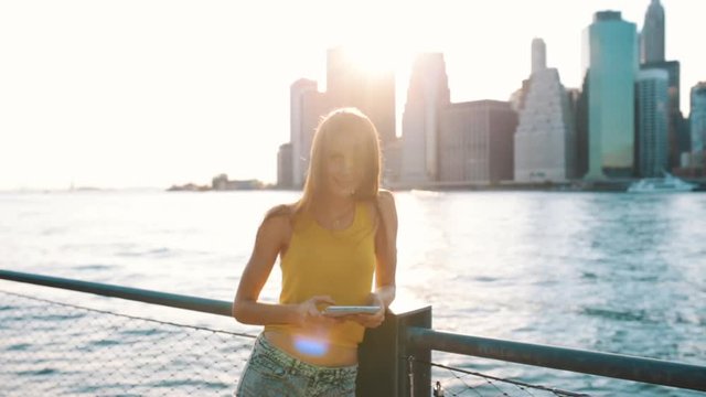 Young Beautiful Woman Using a Digital Tablet in New York City US