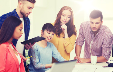 Fototapeta premium creative team with blueprint working at office