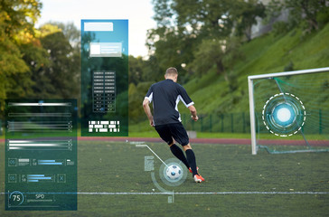 soccer player playing with ball on football field
