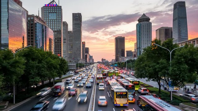 Time lapse of busy freeway traffic at sunset in beijing city，china  