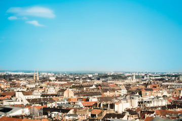 Fototapeta na wymiar Beautiful panoramic aerial view over the roofs of Budapest, old orange tile roofs of buildings and churches on sunny summer day, Hungary. Copy space for text.
