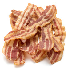 cooked crispy slices of bacon isolated on white background