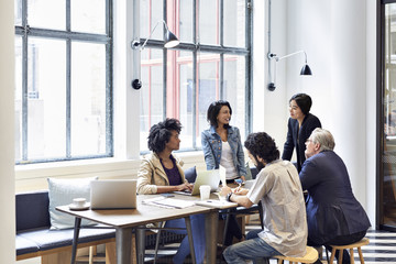 Business people having discussion during meeting in cafe