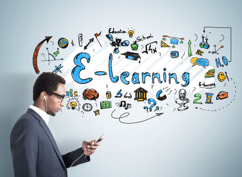 African American man in headphones, e learning