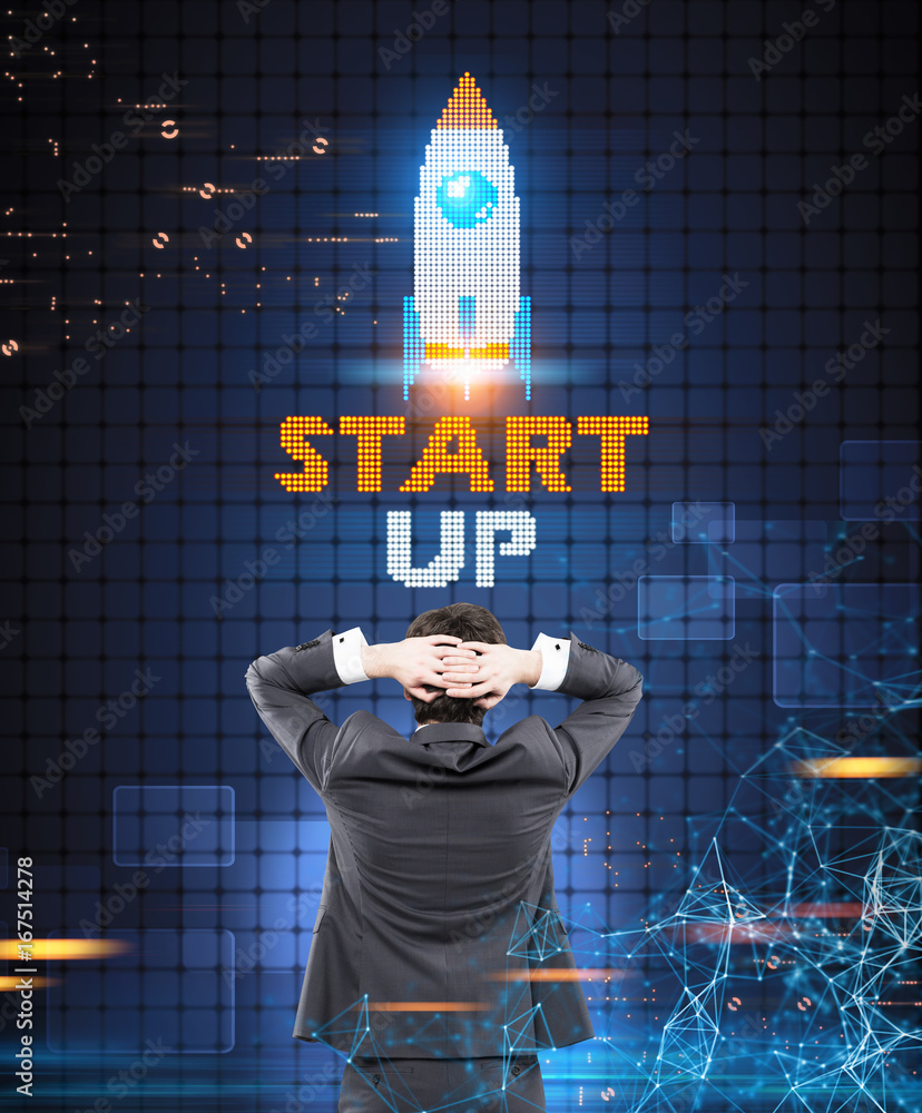 Poster Businessman looking at a start up rocket