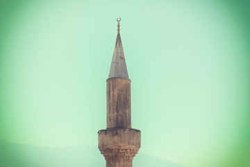 medieval minaret symbol of voice of islam, vintage colored