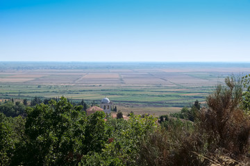 flat landscape with orthodox church in Albania