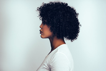 Profile of an attractive African woman against a gray background
