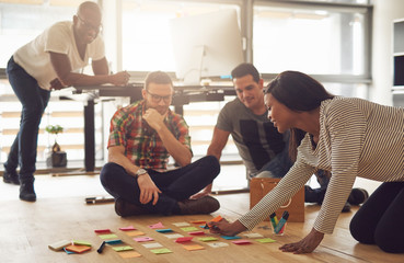 The team brainstorming while sitting in the office