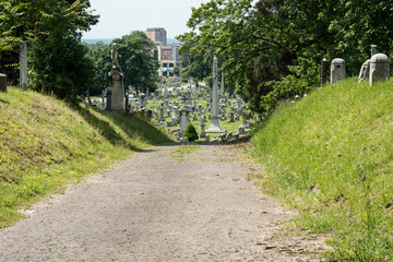 Gravel road in a graveyard located in a city