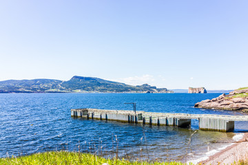 Fototapeta na wymiar Bonaventure Island Park in Gaspe Peninsula, Quebec, Gaspesie region with dock pier and view of Perce rock