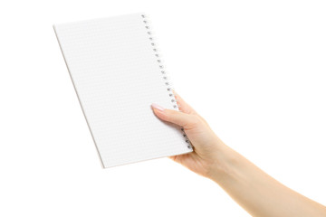 Obraz premium White open notebook in female hand