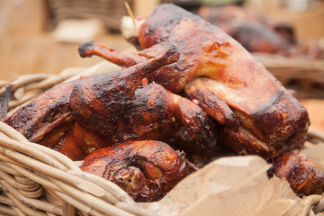 duck cooked on the grill lies in the basket