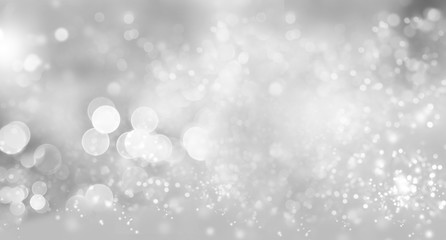 Abstract grey and white lights bokeh blur silver background