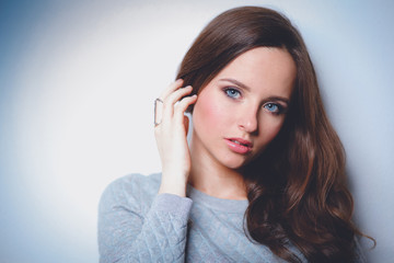 Portrait of an attractive fashionable young brunette woman