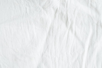 Naklejka na ściany i meble Wrinkled white cotton canvas fabric textured background, wallpaper