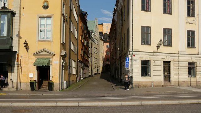 Woman walking in Gamla stan old town Stockholm Sweden