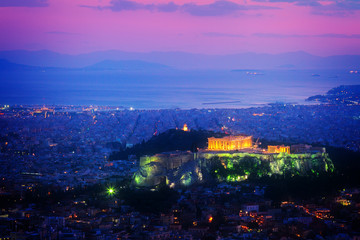 cityscape of Athens with illuminated Acropolis hill and Pathenon temple at night, Greece, retro toned