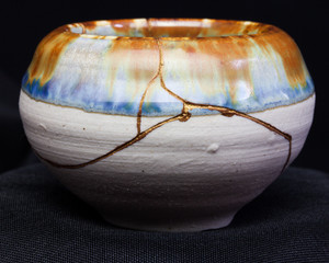A handmade pot made that was broken and I repaired with the Japanese art form of kintsugi.
