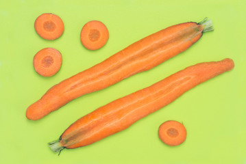 slices of carrot on green plastic cutting board