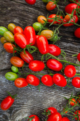 beautiful tomatoes on wooden surface