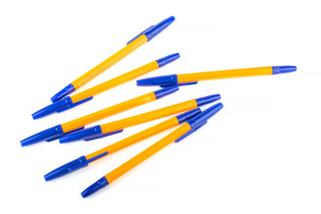 Fototapeta premium Pen yellow and blue cap on white background