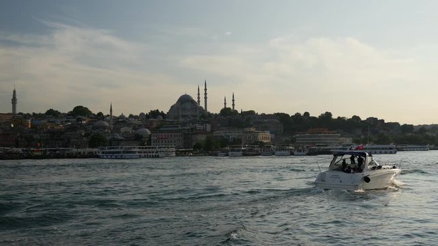 Speedboat at the at the Golden Horn with the &Igrave;&Eacute;_ehzade Mosque in the beackground at Istanbul Turkey