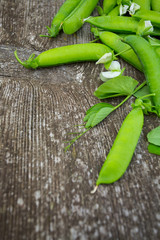 pea pods on wooden surface