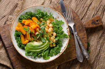 Chickpea, pumpkin and avocado vegetarian buddha bowl.