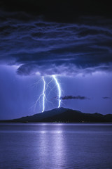 Obraz na płótnie Canvas Two lightning. Heavy thunderstorm at Bukhtarma Reservoir, Eastern Kazakhstan