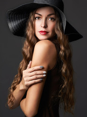 Beautiful young woman in hat