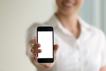 Woman holding smartphone in hands with mock up empty blank screen for mobile ads, place for...