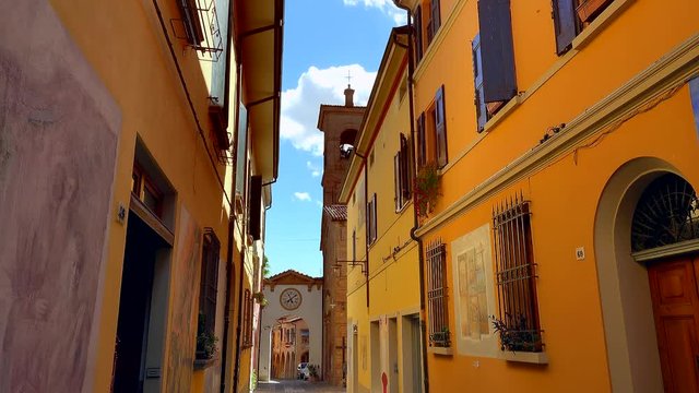 Accelerated shooting of the colorful streets and painted walls of the medieval village of Dozza, a small gem among the architectural wonders of Italy, color graded clip