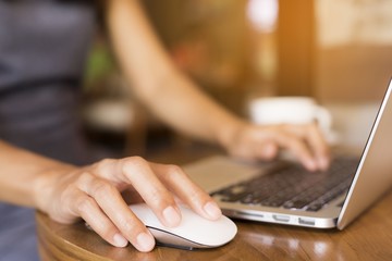Woman is working and she drinks coffee.