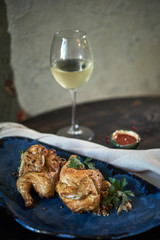 Grilled chicken Tabaka with sauce on stone plate. jpg