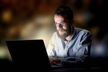 Businessman in the office at night