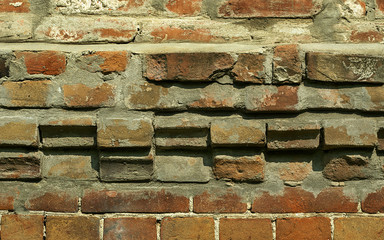 Old brick wall with signs
