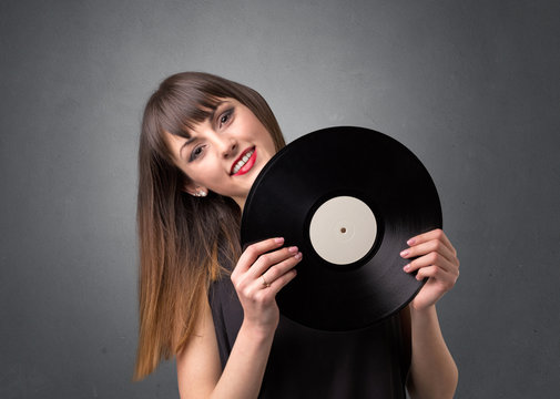 Lady holding vinyl record