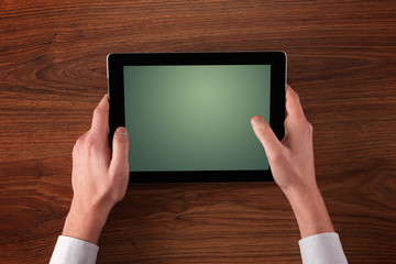 Business hands holding tablet