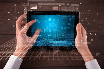 Business hands holding tablet