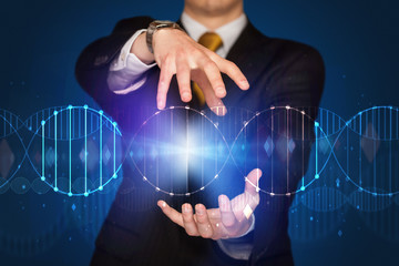 Businessman holding DNA
