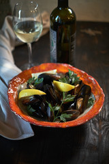 Mussels on ice ready to cook with lemon and white wine jpg