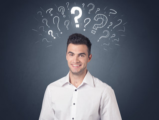 Businessman with question marks